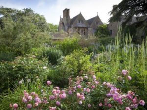 Hidcote Manor Garden that is based in Chipping Campden with many bushes in the foreground.